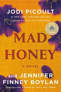 Mad Honey by Jodi Picoult and Jennifer Finney Boylan book cover with gold cover and purple flowers