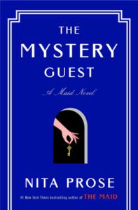 The Mystery Guest by Nita Prose book cover is solid blue with a key hole and key in center.