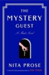 The Mystery Guest by Nita Prose book cover is solid blue with a key hole and key in center.
