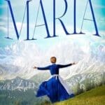 Maria: A Novel of Maria Von Trapp by Michelle Moran book cover features a woman in an Alipne style dirndl in front of a picturesque mountain.