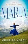 Maria: A Novel of Maria Von Trapp by Michelle Moran book cover features a woman in an Alipne style dirndl in front of a picturesque mountain.