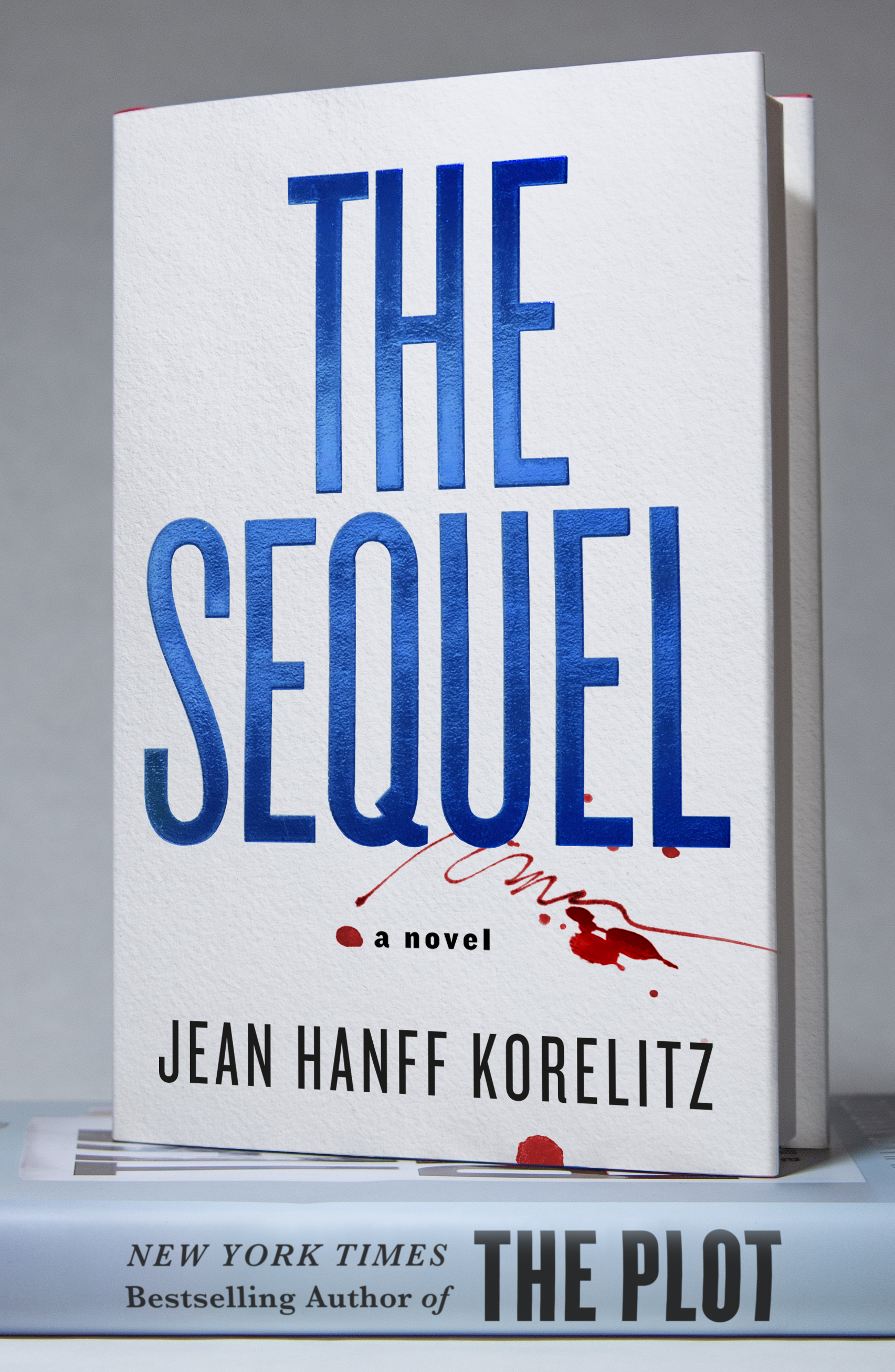 The Sequel by Jean Hanff Korelitz book cover just the title and a splatter of blood. 