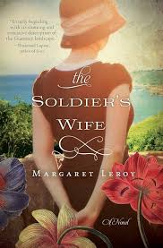 The Soldier's Wife by Margaret Leroy book cover featuring a a woman's back looking over the countryside.